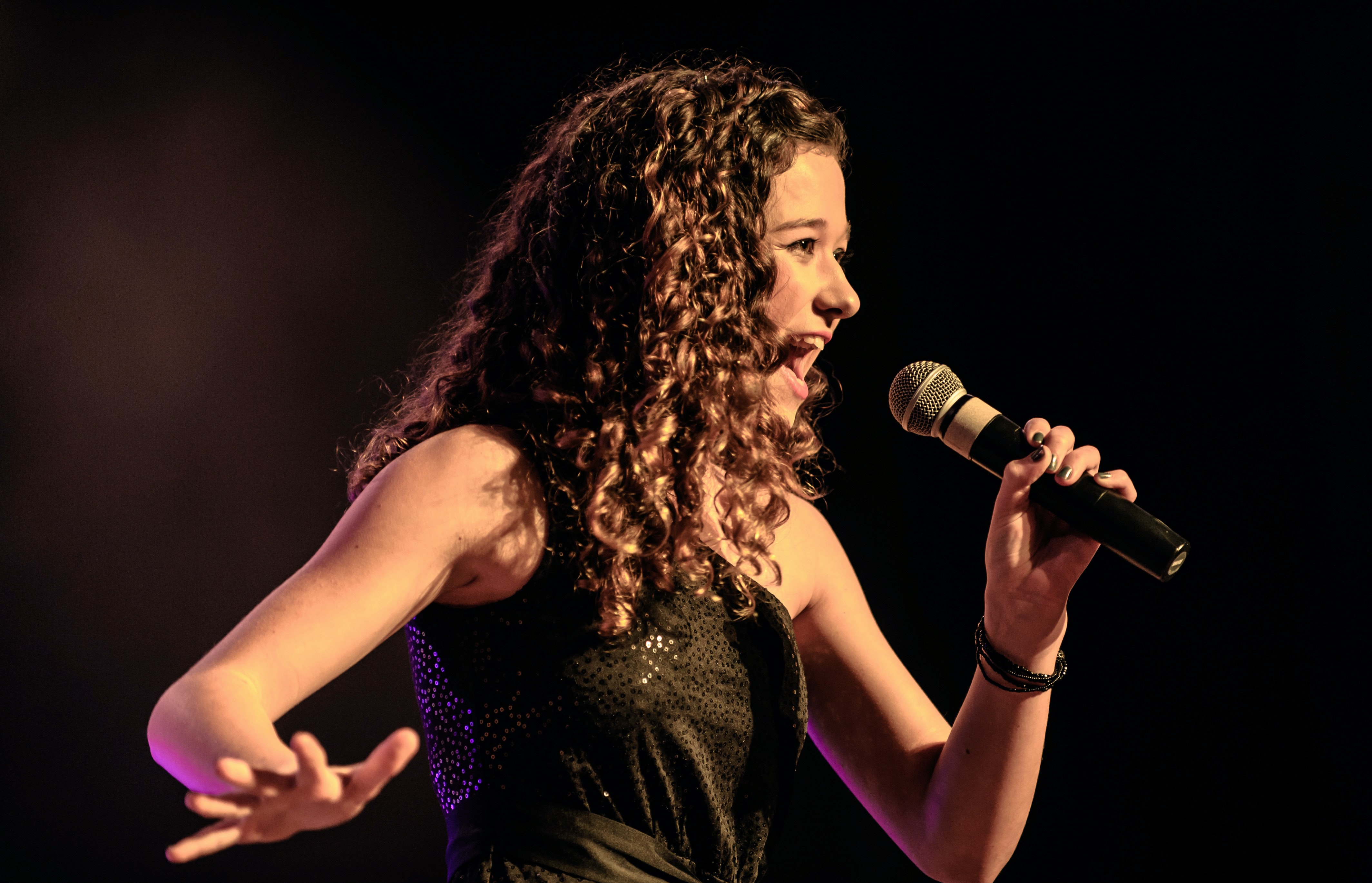 singing into microphone